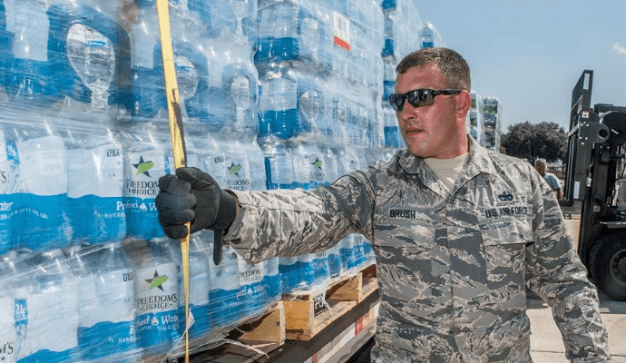 Airman with water bottles